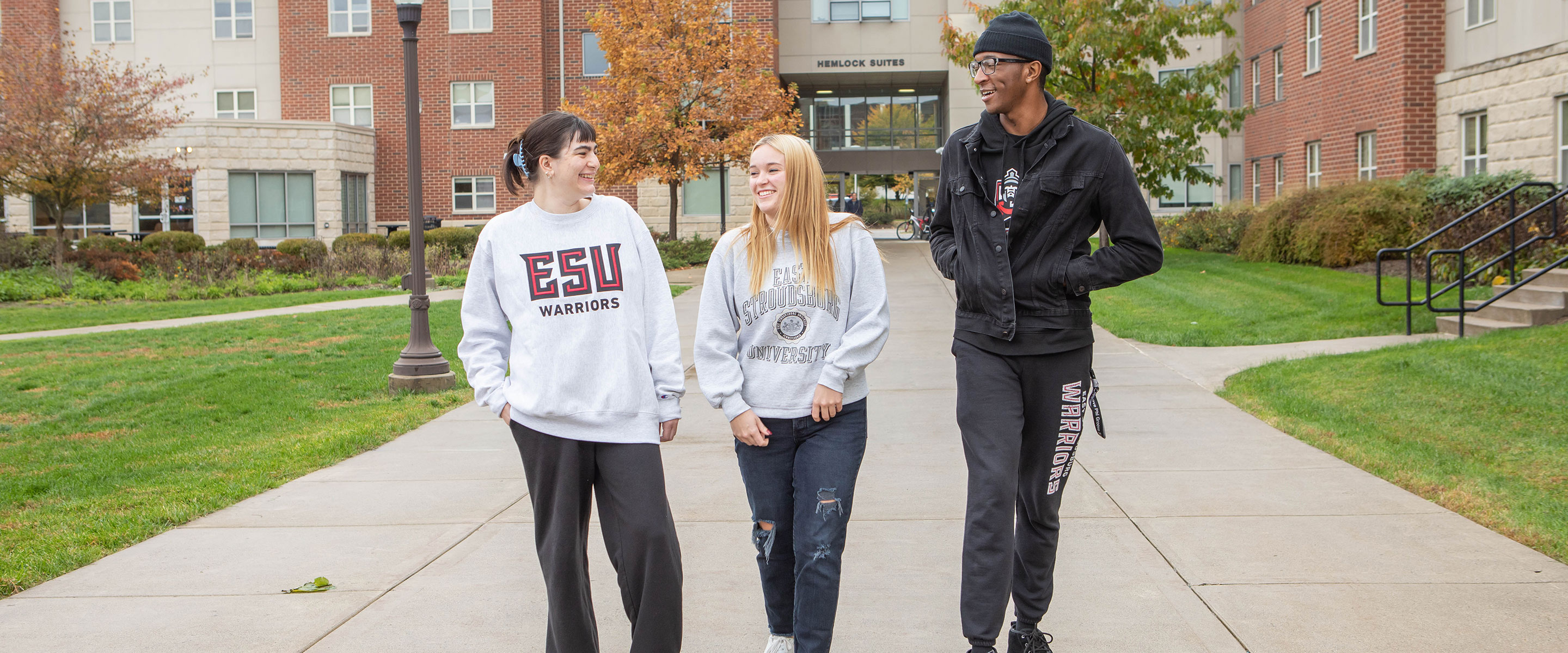 students walking in dorm quad