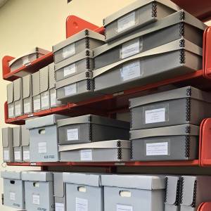 Shelf with boxes of books and files