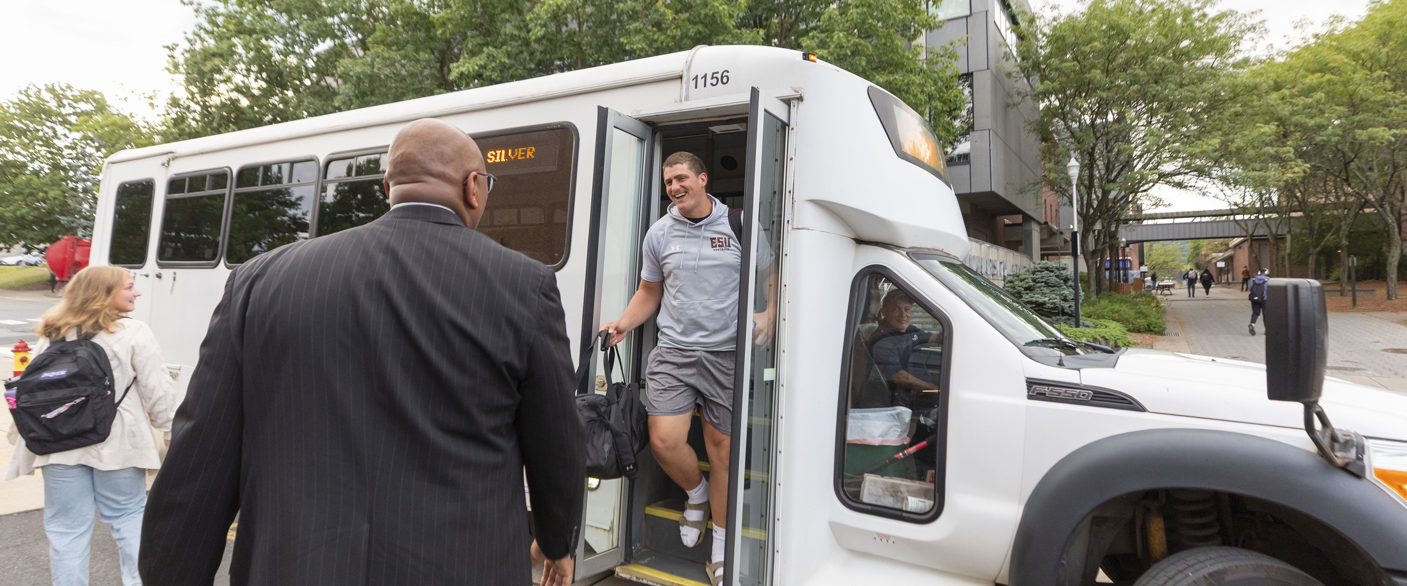 Student getting off bus