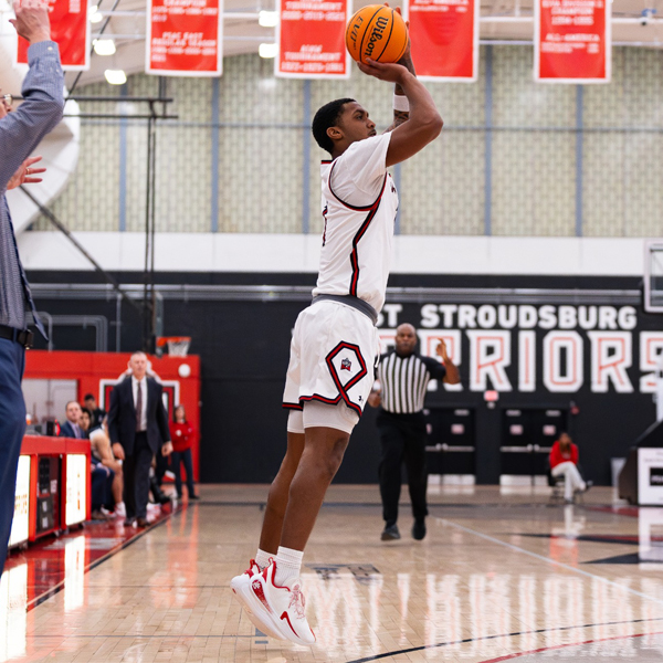 Male basketball player taking a jumpshot