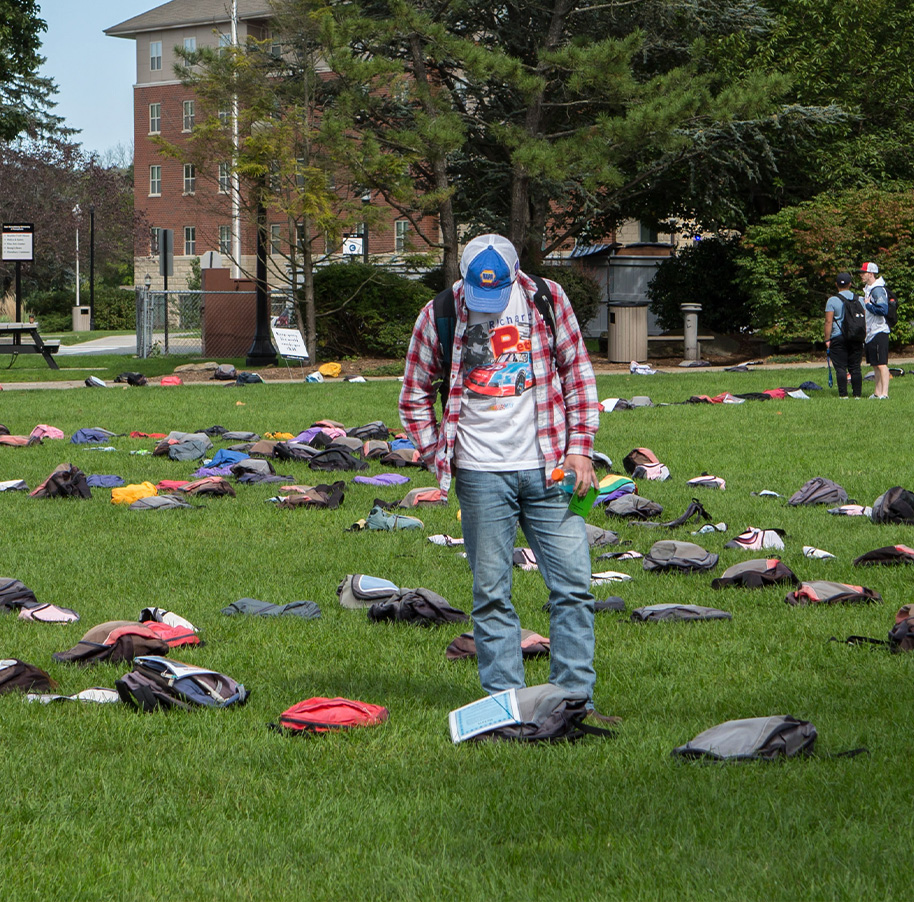 Student at Send Silience Packing event