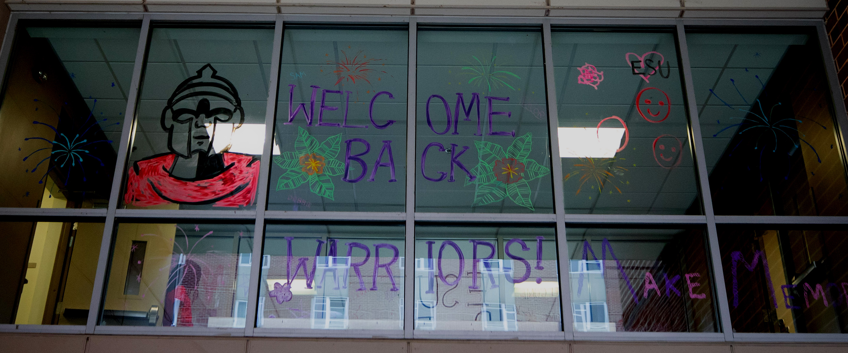 ESU Housing welcome sign painted on overpass windows